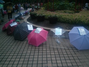 Umbrellas advertising singles at People's Park